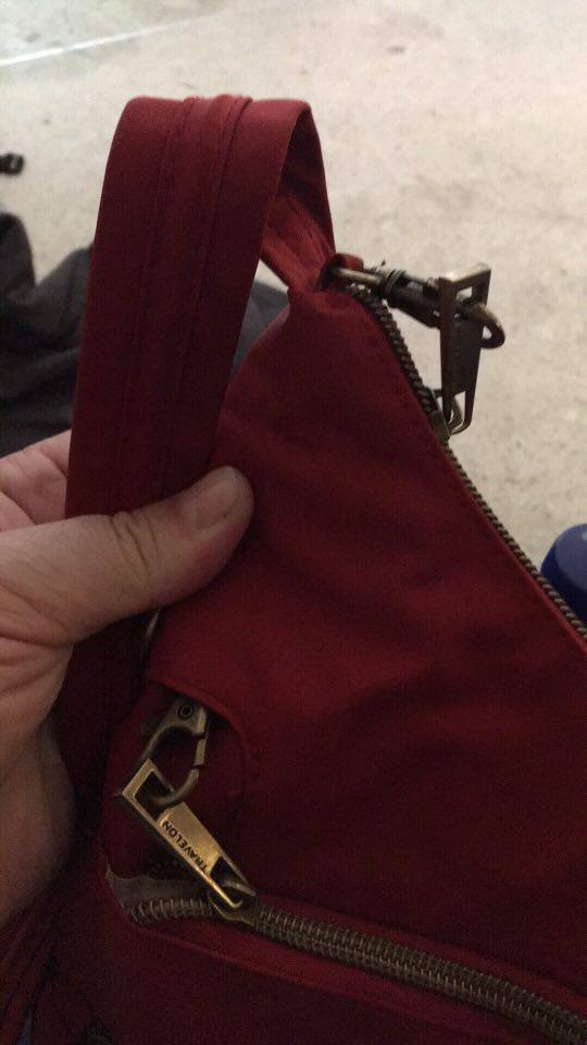 A red anti pickpocket bag