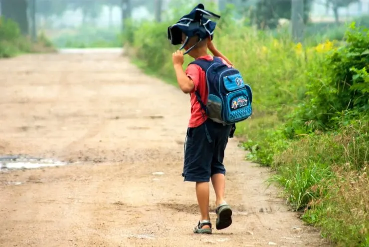 school boy going to school 