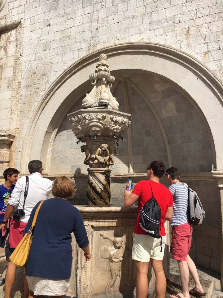 bottle-filling at a fountain in dubrovnik