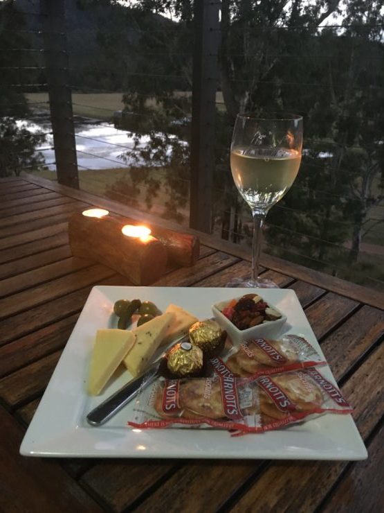 cheese platter with wine overlooking the dam