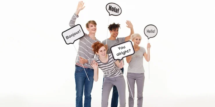 People holding up signs saying hello in different languages