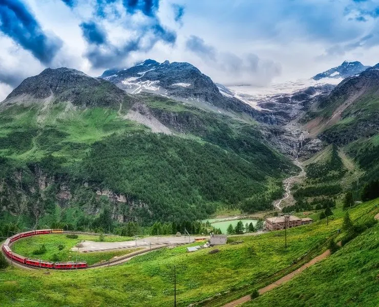 The Bernina Express in a valley in Switzerland