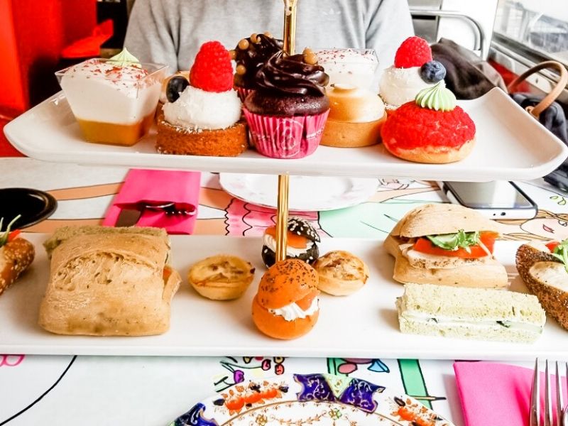 Cakes and savoury selection on a 2 tier plate