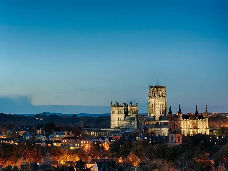 Durham Cathedral with the night sky and lights of Durham