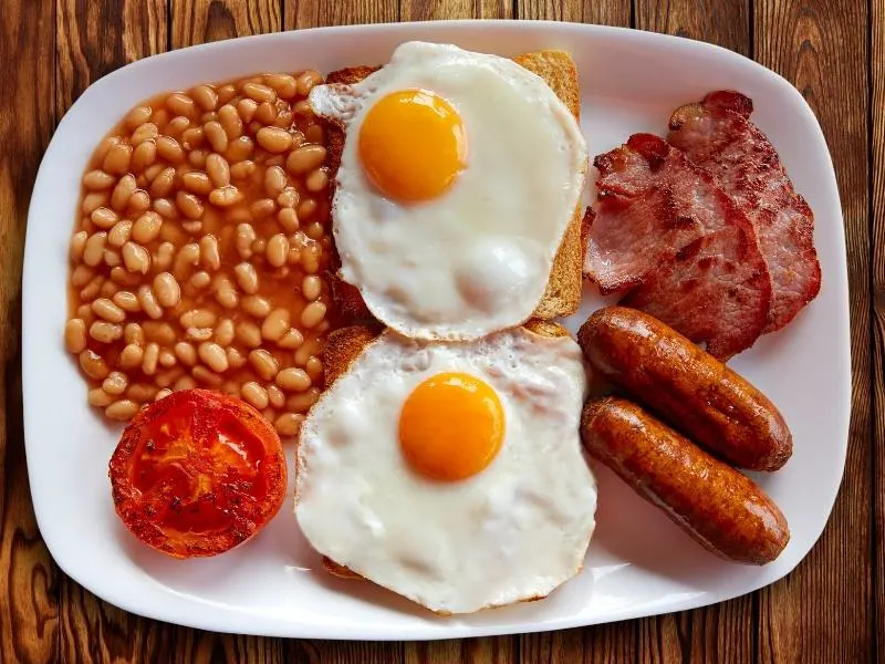 English breakfast with eggs, bacon, sausage and toast