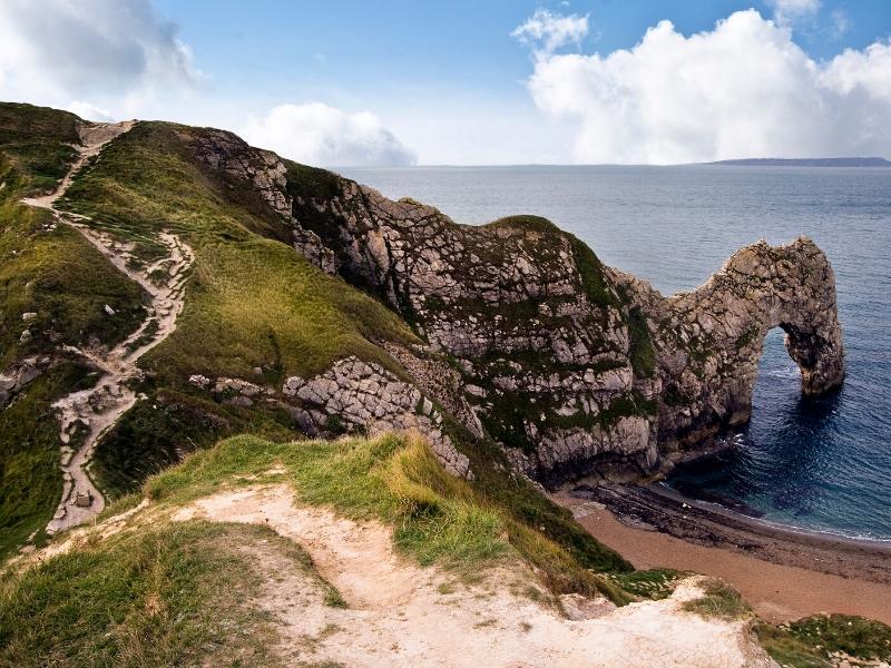 A stone archway into the sea