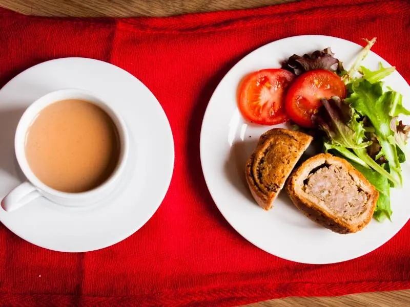 Pork pie with salad and a cup of tea