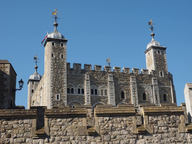 The White Castle at the Tower of London behind a stone wall 