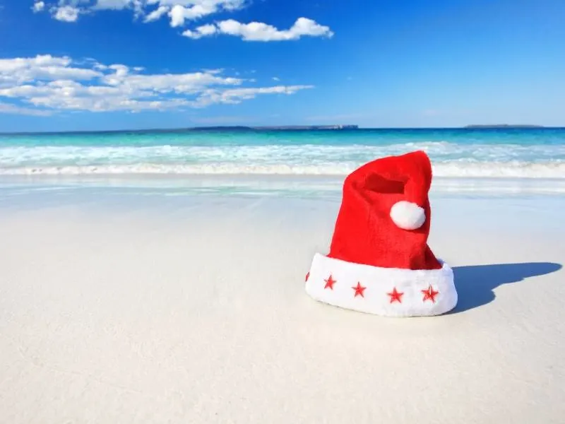 A Santa hat on a beach