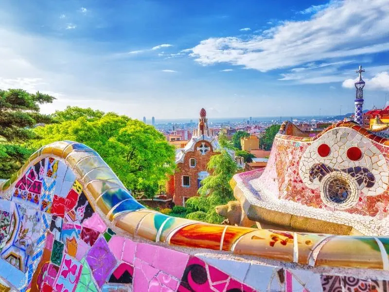 Parc in Barcelona by Gaudi with bright coloured tiles decorating the walls
