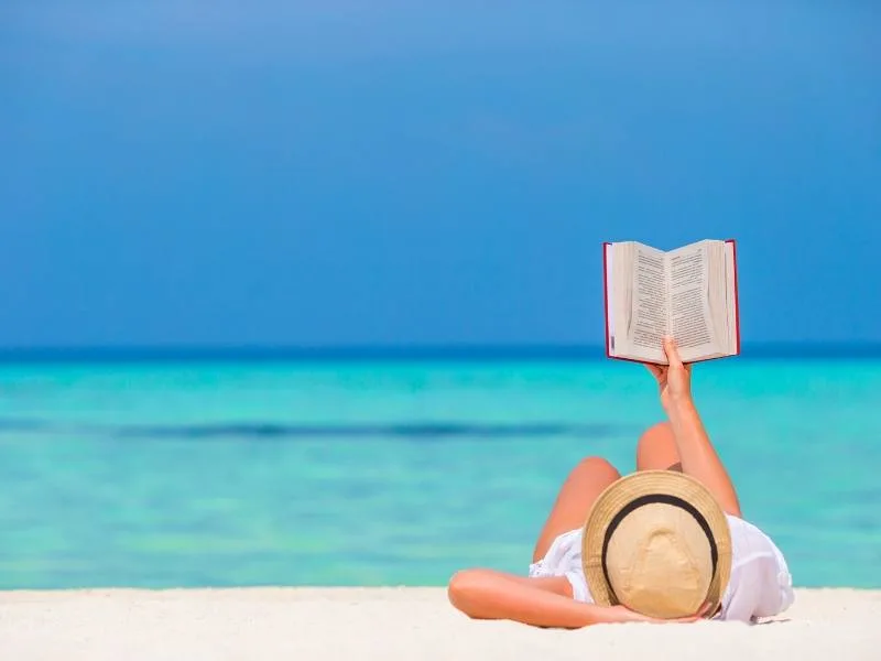 Reading a book on a beach