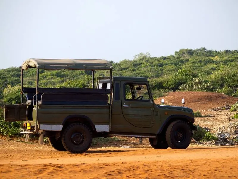 Think about what to wear on safari in South Africa as the open sides on the jeep as shown in the picture can mean it can be very cold 