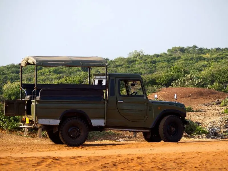 A jeep in South Africa showing that useful tips for safari include taking a jumper as they are open sided so it can be cold in winter