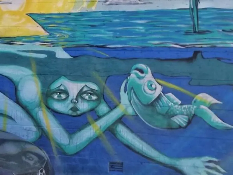 Street art of a mermaid and a fish