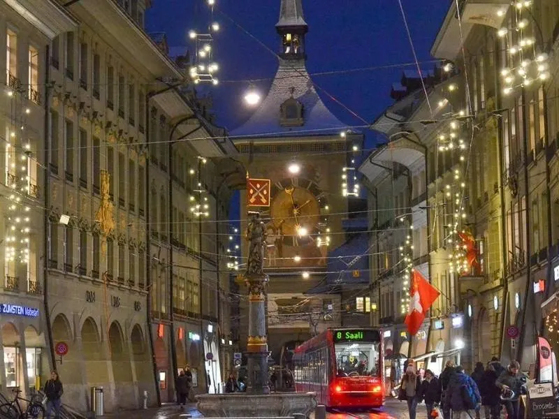 The main street in Bern at christmas lit up with decorations and lights