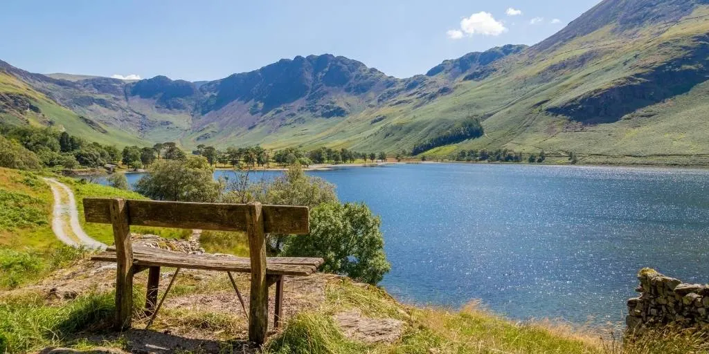 A bench overlooking a lake in the Lake District England