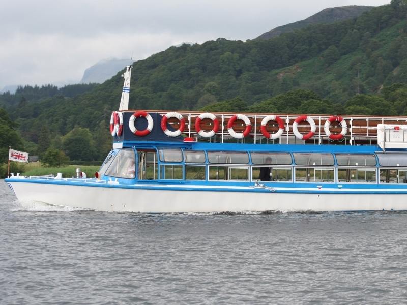 A boat crossing Lake Windermere on of many things to do in Lake Windermere