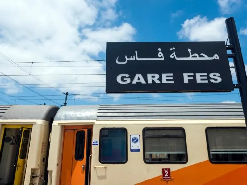 Fez train station and a train waiting at the station