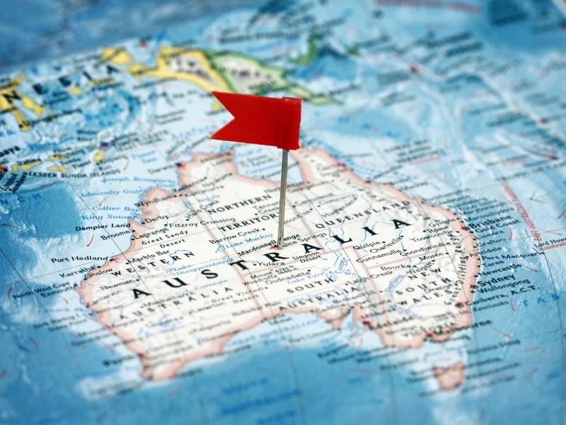 Map of Australia with a red pin flag in it.