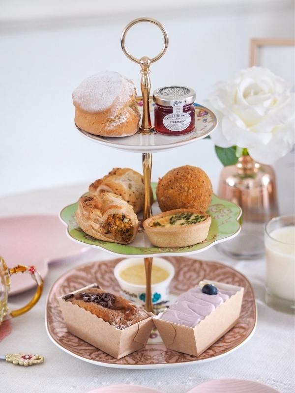 Piglet's Pantry afternoon tea in a box presented beautifully on a stand