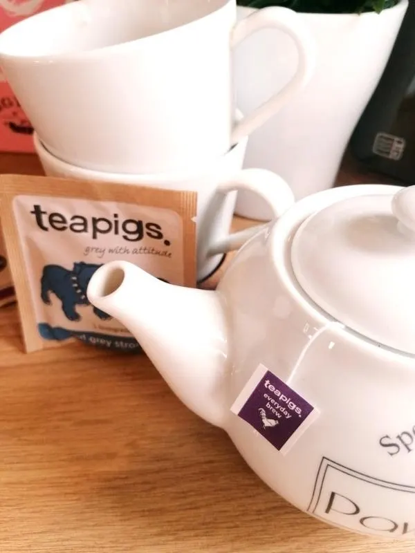 An afternoon tea in a box  by Piglet's Pantry with Piglet's Pantry tea bags and teapot. 
