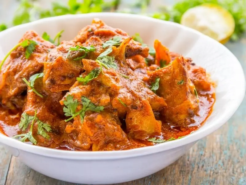 chicken tikka masala in a white dish.