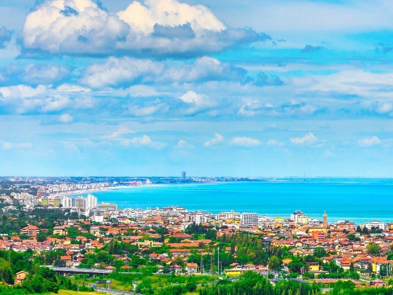 Italy's Adriatic Coastline with buildings and the sea.
