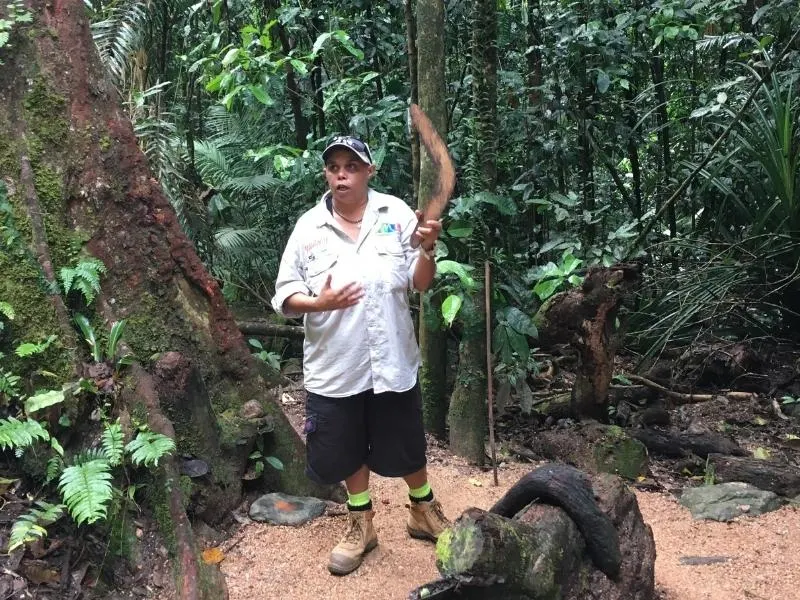 Woman with boomerang on Mossman Gorge Tour.