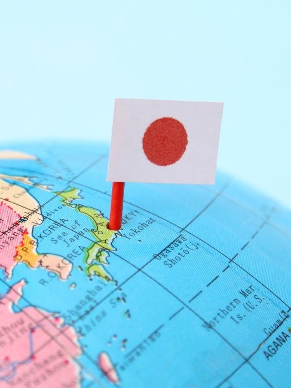 World map with a Japanese flag.