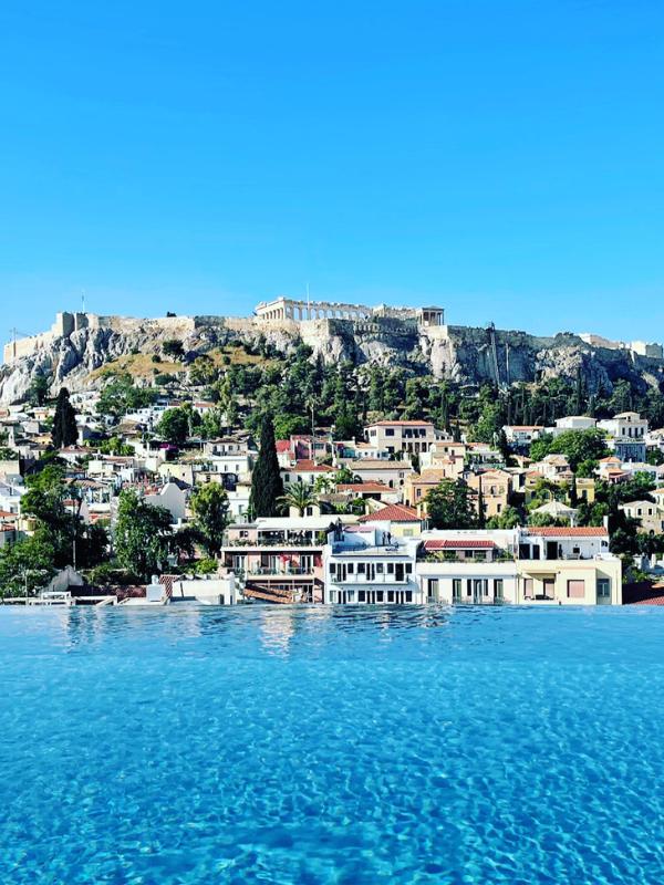 View of the Acropolis from the Dolli Hotel  which is where to stay in Athens for a luxury experience.
