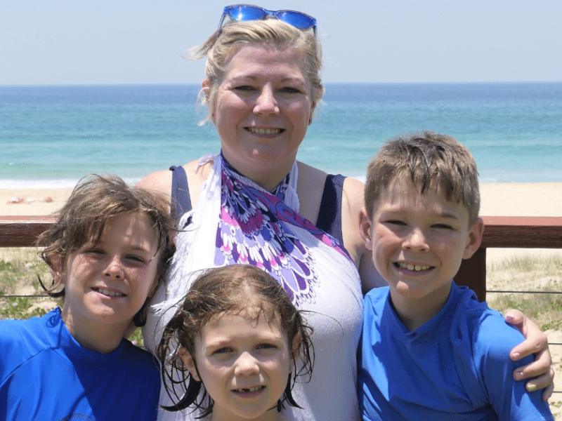 Karen Bleakley and children at the beach