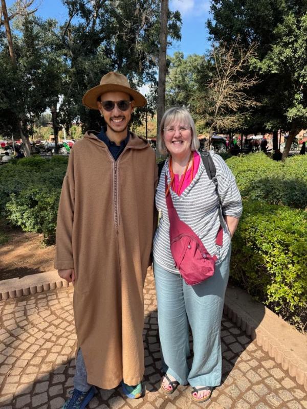 Man stood next to a lady.