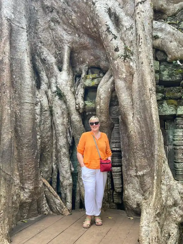 Tracy and a large tree in Cambodia