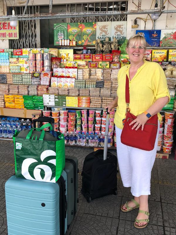A lady with a suitcase.
